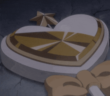 a heart shaped object with a gold star on top