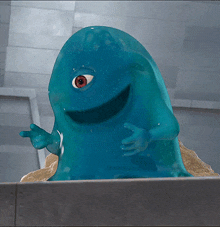 a blue monster with a red eye is standing on a pile of dirt