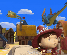 a girl in a red witch hat stands in front of a frog and a dragon with type " shirt " written on the bottom