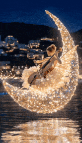 a woman is sitting on a crescent moon playing cello