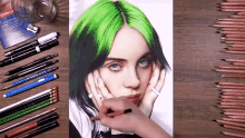 a drawing of billie eilish is on a table with pencils