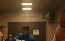 a group of people in fantastic four costumes are running in a hallway