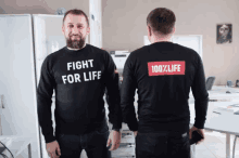 a man wearing a black sweater that says fight for life
