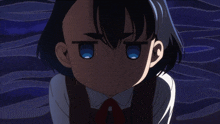 a close up of a girl with blue eyes making a funny face