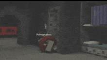 a dark room with a brick floor and a red item in the corner