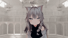 a girl with a cat ear on her head looks at the camera
