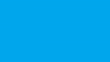 a hand is holding a piece of paper against a blue backdrop