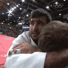 Hug Mansur Isaev GIF - Hug Mansur Isaev Olympics GIFs