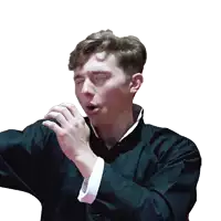 a man in a black jacket is making a face with his eyes closed