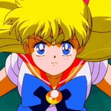 a close up of a sailor moon anime character