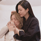 two women hugging each other with a watermark that says lingorwoifsr
