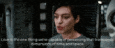 a woman is sitting in a chair with a quote that says love is the one thing we 're capable of perceiving