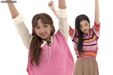 two girls are standing next to each other with their arms in the air and the words honeycam.org visible