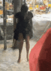 a blurry picture of a person walking in the rain