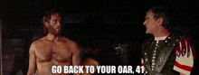 two shirtless men are standing next to each other and one of them is saying go back to your oar 41