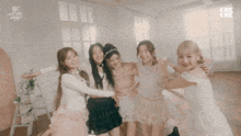 a group of girls are posing for a picture with the words " in the stage " on the bottom