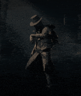 a man in a top hat is standing in a dark forest with a gun belt that says ' bullets ' on it