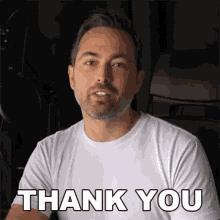 a man in a white t-shirt says thank you