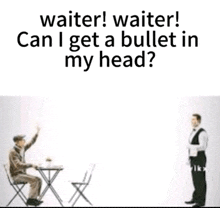 a waiter is talking to a man sitting at a table while another waiter stands behind him .