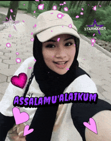 a woman wearing a hat and a hijab says assalamu ' alaikum