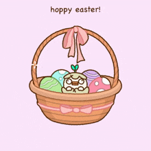 a basket full of easter eggs with the words hoppy easter written on the bottom