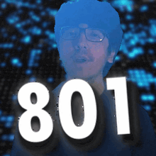 a man with glasses stands in front of a sign that says 801