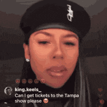 a woman wearing a black beret says " can i get tickets to the tampa show please " .