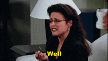 a woman with glasses says well in yellow
