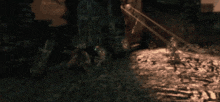 a blurred image of a person standing in front of a stone wall