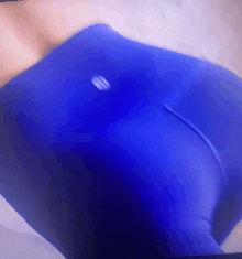 a close up of a person wearing blue pants