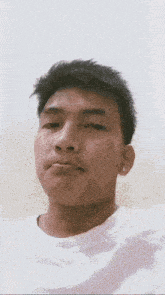 a young man with a beard is making a funny face with his mouth open .