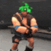 a man wearing a green hat is holding a sword in a video game .