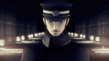 a man wearing a hat with a circle on it is standing in a dark room