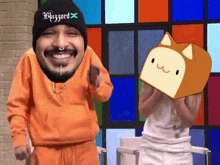 a man wearing a beanie that says blizzard stands next to another man