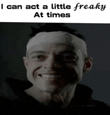 a man with a bandage on his head is smiling and says " i can act a little freaky at times "
