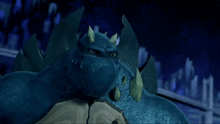 a blue cartoon character with horns on his head looks at the camera with a city in the background