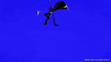 a person is holding a sword in their hand and a sword is flying in the air .