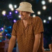 a man wearing a hat and a shirt with netflix written on the bottom