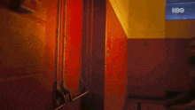 a blurry picture of a person standing in a room with a hbo logo in the background