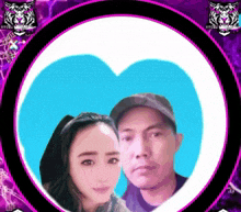 a man and a woman are standing next to each other in a purple heart shaped frame .