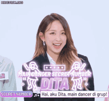a girl is smiling in front of a banner that says maindanger secret number dita