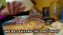 a person is leaving a bowl of food with the words we 're leaving in 3 seconds below them