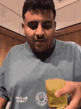 a man wearing a shirt that says ' gulf coast ' on it