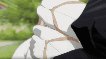 a close up of a person 's hands with a bandage on it