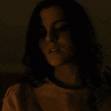 a close up of a woman 's face with her eyes closed
