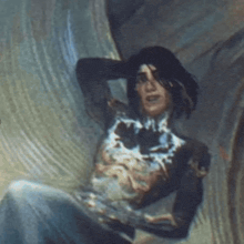 a close up of a painting of a woman sitting on a couch .