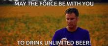 a man in a purple shirt holds a can of beer in front of a field of flowers