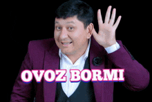 a man in a purple suit with the words ovoz bormi written on the bottom