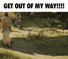 a man walking down a dirt path with the words get out of my way on the bottom