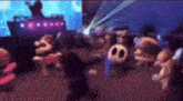 a group of cartoon characters are dancing in a room with a dj .